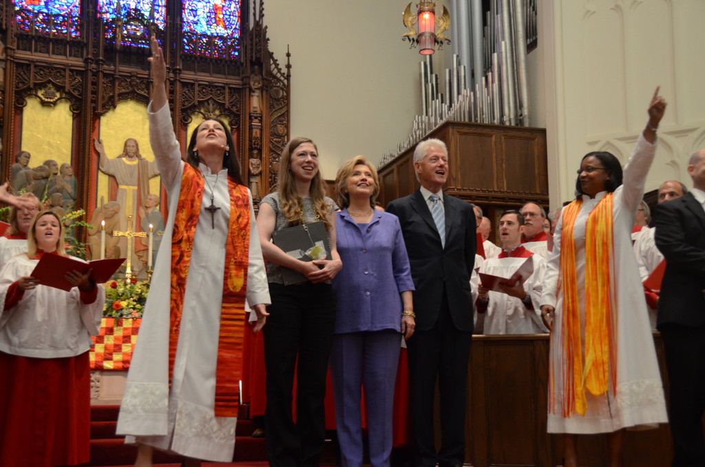 The Rev. Ginger Gaines-Cirelli, left, Senior Pastor of Foundry UMC in Washington, D.C., offers the benediction during the church's bicentennial homecoming service on Sept. 13. To her left stand Chelsea Clinton, her mother, Hillary Clinton, and her father, former President Bill Clinton. At the far right is the church's Executive Pastor, the Rev. Dawn Hand.